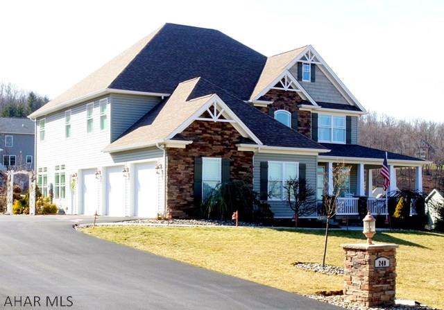 Custom designed home in Pleasant View Est. has 4 bedrm, 3.5 baths & 3 car garage. The minute you step onto the sprawling wrap around porch you know this special home is for you. Cherry Brazilian flooring throughout the lst floor. Maple cabinetry, granite counter top with back splash, a spacious breakfast bar. Kitchen opens into the large living rm with two sided stone gas fireplace, crown molding, lst floor office/den & laundry. The  second floor features M.bedrm w/tray ceiling, recessed lighting & large walk-in closet. M. Bath has a walk-in shower & whirlpool tub. 2 bedrms share Jack n'Jill bath & 4th bedrm has its own full bath.  Screened-in sun porch leads to a paved patio and  beautifully landscaped yard. Many extras with this unique home. PLEASE SEE THE VISUAL TOUR.