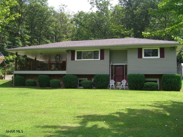 Enjoy this well kept split level home on a large 1.32 acre lot with an adjacent 0.47 acre lot behind the home. Located only 2 miles from a boat launch to Raystown lake. The roof, siding and windows have all been recently redone. There is also a detached garage and two metal canopies for parking your vehicles or boats, etc.
