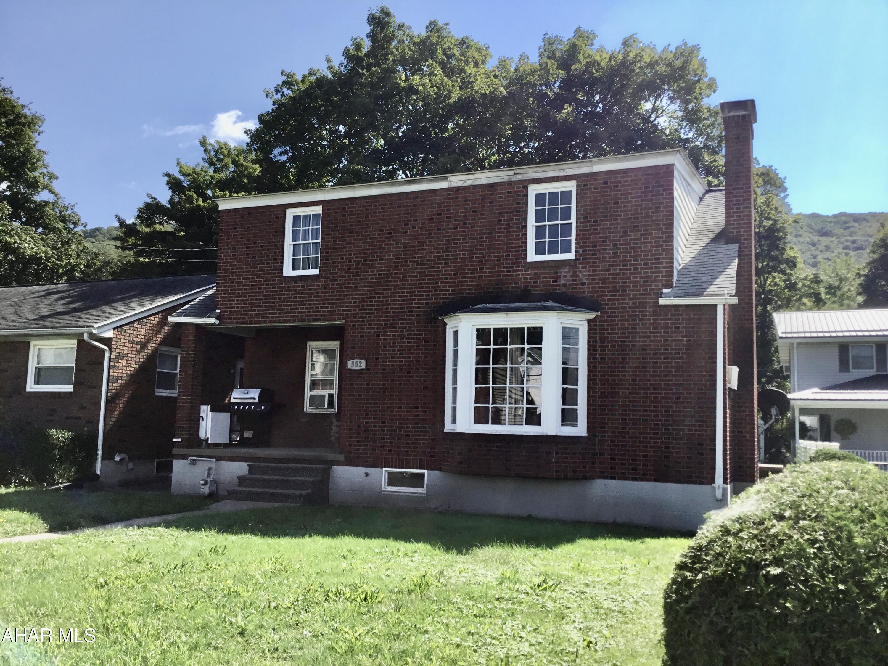 One and a half story brick home, 4 beds and off-street parking in rear.  Newer Furnace and updated bathroom.  Measurements may not conform to ANSI practice of standards.  Sq Ft and Taxes per tax card buyer to verify.