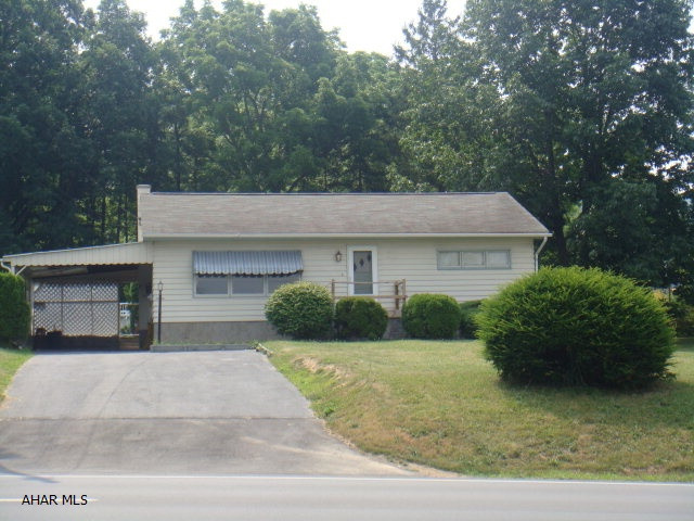 Great starter home or perfect for downsizing. Small fenced yard with carport. 2 sheds. Currently residential but could possibly be highway business.
