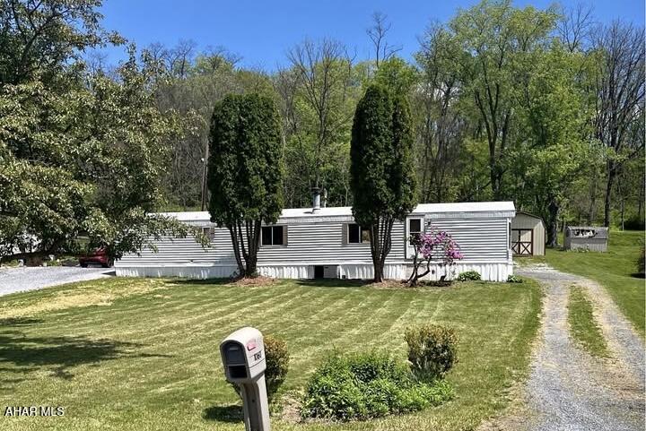 Looking for affordable, easy living? This well-maintained 2-bedroom, 1-bath, 14' x 66' manufactured home sits on a spacious 0.39-acre lot and offers comfort, convenience, and value. Inside, you'll find all newer flooring, a cozy wood-burning stove in the living room, and a functional floor plan designed for everyday living. The central air system has been fully serviced for added peace of mind, and the storage shed provides extra space for tools, lawn equipment, or seasonal items. Whether you're looking for your first home, a more manageable space, or an investment opportunity, this property is one you won't want to miss!