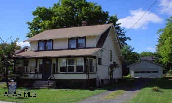 Hollidaysburg Borough Beauty. Simply charming home with newer roof, furnace and electric service. Beautiful sunroom, very nice yard, 2 car detached garage w/opener, plus 2 enclosed porches!