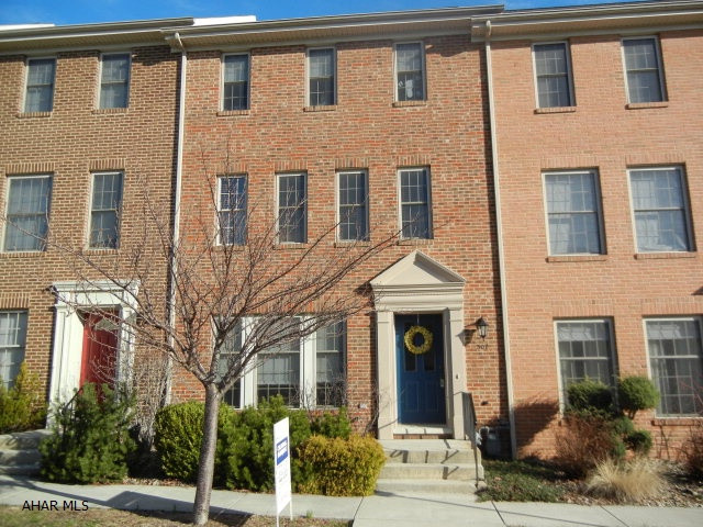 Sweet Cherry Court Townhouse.  New deck, hardwood floors, yard is fenced, and off street parking.  Lower level can be finished as you wish.
