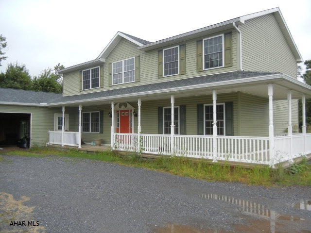 Newer two story on large, cleared lot.  Needs some TLC particularly interior, and garage doors. Basement is unfinished.