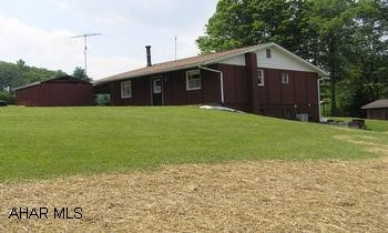 Nice 3 Bedroom Ranch on 17+/- Acres with Pond and Stream, Central Air and Fireplace.