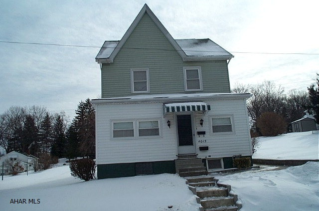 Two-story vinyl sided three bedroom home situated on 100 x 120 lot.  Small third bedroom leads to attic.  Eat-in kitchen.  Front and rear enclosed porches.  Toilet and shower in basement.  Hot water heat.  50' side lot.