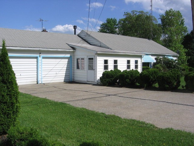 Nice back Sun Porch with great view of mountains.  Eat-in kitchen, formal dining room/Bonus Room, enclosed front porch, hardwood floors, central air and newer furnace. #J-985.