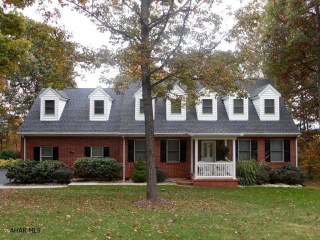 Quality Cape Cod in beautiful Ridgewood Heights! Classic Williamsburg styling. Custom oak cabinetry & woodwork thru-out. Eat-in area in kitchen walks out to a spacious deck that has beautiful views of the back yard and the valley. Laundry/mud room off kitchen & 2 car attached garage. First floor den or office that could be a 1st floor bedroom, 2.5 BA. Hardwood floors, ceramic tile. Exceptional master suite with Jacuzzi. Large bonus room that could be a 5th bedroom. So many extras including Pella windows, retractable awning, professional landscaping including a 3 tier retaining wall, propane fireplace, in ground wire dog fence, fenced-in yard, security lights, gutter shield, auto attic fan, radon system & 10'x 20' shed. Quality construction throughout. Freshly painted and move-in ready!