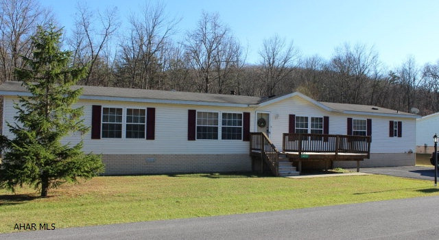 Very nice double wide with front and side decks on rented lot in Pinewood Acres. Steam cleaned carpets, new wood grain laminate flooring in kitchen and laundry! Some new insulation underneath.Master suite has 2 bathrooms and spacious walk-in closet. Kitchen has plenty of cabinets, island, and eat-in area. Large level yard. Off street parking on paved driveway. 8 x 10 shed included.