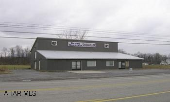 Commercial building on Rt. 220. Includes office, showroom, work area, and storage. Could be sub-divided. Great visibility!