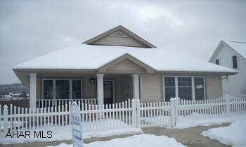Deck off family room w/ Sunbrella awning.pergo floors and carpeting. Deck also off Dining area.