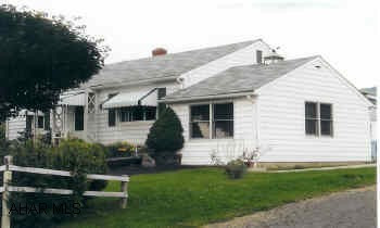 2 Bedroom Vinyl-suded Ranch Home. Detached 2-car garage.