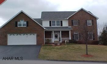 Inviting - Spacious!  2 Story Brick Vinyl Exterior.  Beautifully landscaped with vinyl fencing around poolm hot tub - this house has it all! Large Master Suite with walk in closet and office.  Master Bath with whirlpool tub & shower, 2nd floor laundry, beautiful hardwood floors in Family Room and Dining Room.  Oak kitchen with breakfast nook. Covered deck - 2 gas fireplaces.