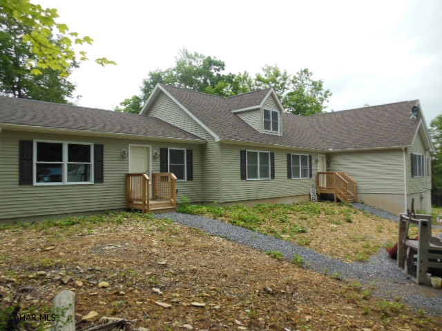 Reduced! Motivated!  Don't miss this chance to own your own beautiful property 10 mins from Altoona and only 35 minutes from State College!  Two miles from Bellwood Antis School.  Close to city living but set in a rural scene.  Large, beautiful new home sitting on 29 acres of wooded ground with winding stream running through it.  Absolutely perfect haven for the hunter or fisherman in your family.  This ranch home boasts a large 40x12 composite deck overlooking the ground and has a unfinished full basement with an integral one bay garage.  Large bedrooms with a master suite with a soaking tub and separate shower.  Also a separate mother-in-law suite with its very own private entrance and sliding glass door that leads to the back deck.  A brand new kitchen with s/s appliances & MORE!