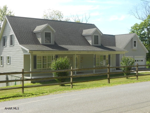 Low maintenance Cape Cod built in 2006. Vinyl sided home. Five bedrooms, 3.5 baths on 23.687 acres. Just waiting for you to call it home. Sits close to road for easy driveway care. Most of the property is beside and behind with trees, trails and stream. Could be a hunting paradise. Kitchen is cherry cabinetry w/ double ovens and Jenn Air gas stove top with breakfast nook. Main floor master bedroom with garden tub and shower. Inviting sunroom in back to enjoy the view. Huge basement with 10' ceilings. Attached 2 car garage with walk up storage area. Great price!!