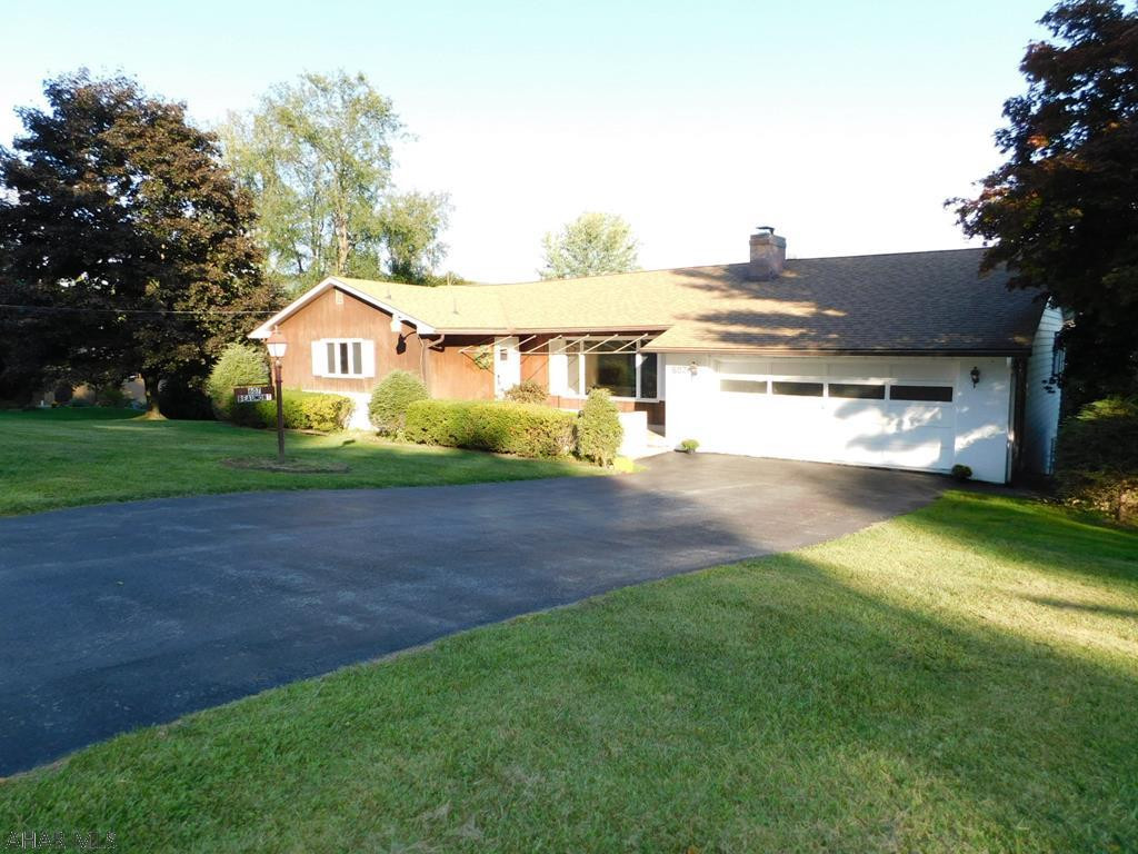 LOCATION LOCATION and...GREAT BONES! This sprawling rancher is laid out beautifully.  Large rooms and hardwood floors throughout.  Newer roof and Furnace new 200 amp electric.  Basement is high and wide open and ready to finish off to your liking.  Oh yes and the lot is amazing!  Plenty of elbow room.  A little love will make this your forever home.