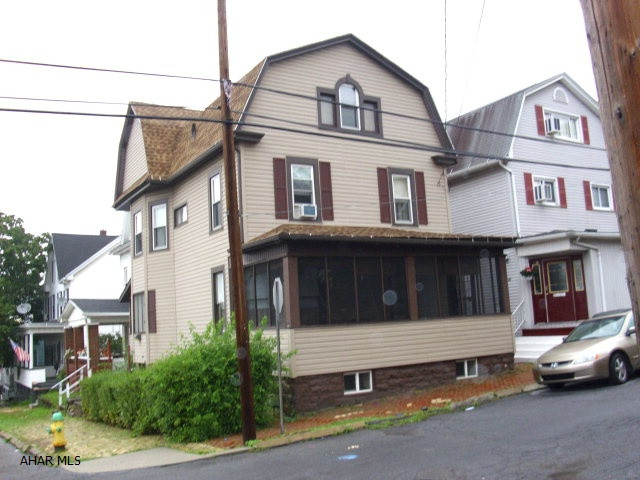 2.5 story home in Altoona. 3 bedroom .75 bath,  & 1/2 bath in basement. 2 screened porches. Finished attic. Mechanics are good. Security system.