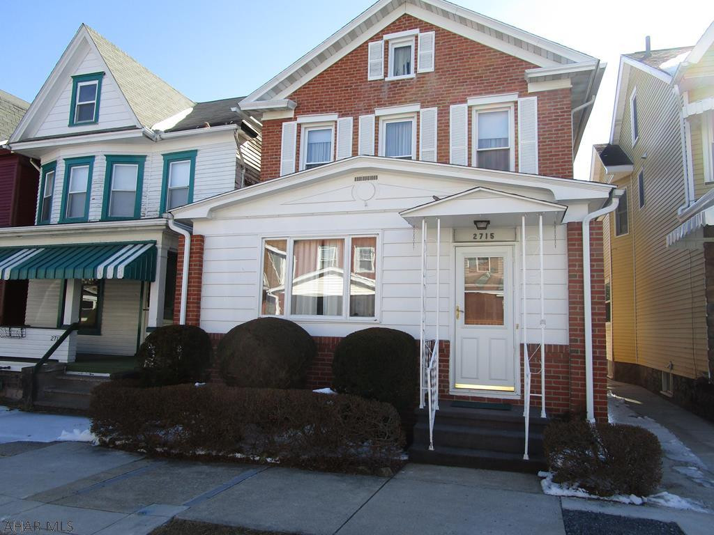 Great family home in nice area features spacious living and dining rooms plus two extra rooms for den, office or playroom on first floor.  Second floor offers three large bedrooms and a fourth small room for possible nursery or walk-in closet.  Brick construction, newer windows throughout.  Recently installed gas line in street and lateral to property.  New water heater.  Seller reports HW floors under the carpet on first level.  Oversized detached one car garage with separate storage space has vinyl siding.  Walkout basement.