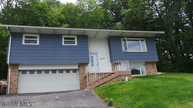 TAKE A LOOK- Newly remodeled bath. Nice master suite w/ fireplace and walk-in closet in lower level. 3 Additional bedrooms on main level. Maintenance free deck. House located on dead end street, laundry area in kitchen. Nice neighborhood.  Easy to Show.
