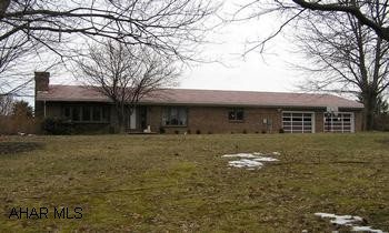 Sturdy Brick Ranch, 3BR/2BA, full partially finished basement. 2-car attached garage on 1+ acre. Beautiful ornate ceilings in every room, 3 entrances to garage - interior, exterior and garage. Central air, wood burning fireplaces in both living room and basement recreation room, laundry area in kitchen & basement.