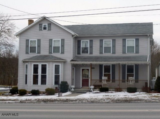 This lovingly maintained and improved 4-5 bedroom 2 bath two story was seen in Christmas tour 2010 and boasts 3900 sq, ft.! Possible one floor living, spacious open Family Room off kitchen area, 34x30 covered deck connects house to detached, oversize 2-car heated garage with 1073 sq. ft. apartment. One bedroom apartment w/large bath, living area w/wet bar. Flagstone patio adjacent to 1800's district judges office. Terrific value - tons of room - and a complete refurbishing by present owner. Close to Shawnee State Park.