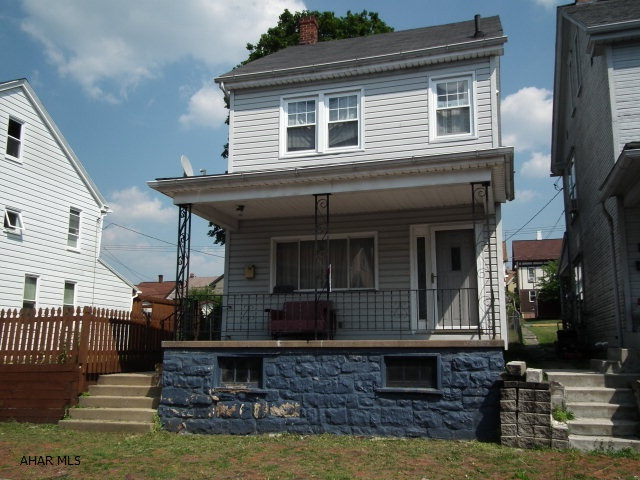Come see this 2 bedroom (possibly 3)& you won't be disappointed.  Kitchen and bath have ceramic tile floors, dining room has double doors leading to side deck for you to enjoy.  Plenty of outside space & parking area behind property as well.  Kitchen appl's included, as well as washer/dryer, making this ready for you to move in today!