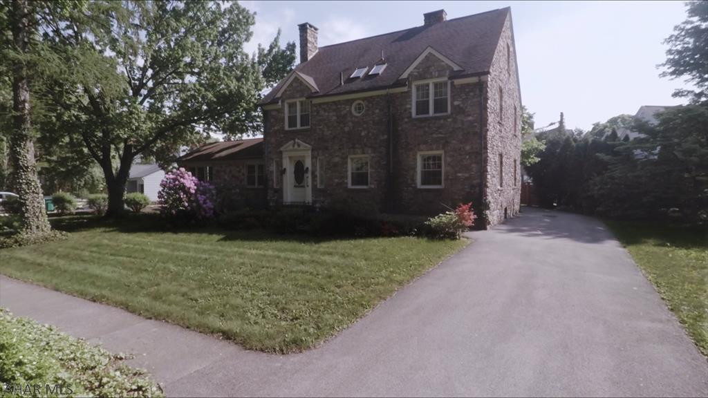 Welcome to one of the classic beauties on Mansion Blvd in Altoona.  This 1939 beauty is a unique natural river stone home on one of the largest lots in Mansion Park ..  The rooms in this home are HUGE - with many crystal chandeliers!  Foyer opens up to an open winding stairway leading to 2nd floor.  Master bedroom has a cedar lined walk-in closet with plenty of shelving that rivals it in size.  A large newer addition built to match the original home has a river stone fireplace, wet bar, and  built in bookshelves, plus a half bath.  Take a step back in time and imagine yourself in Tuscany - this property even has grape arbors and a stone courtyard.    Three fireplaces too.  Plenty of off street parking.