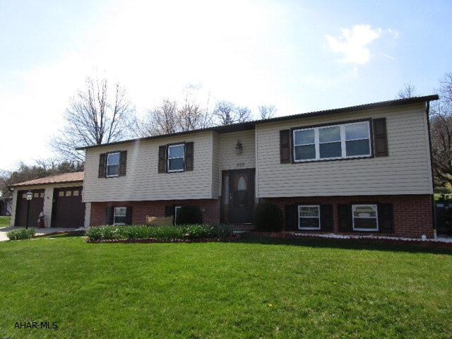 This split entry home is meticulously maintained inside and out!!  The main level offers a living room, kitchen w/ oak cabinets and solid surface counters, dining room, large sun room, 3-beds and 2-full baths.  Lower level offers a large family room, additional bedroom, full bath, den and bonus room.  Lower level could easily be used as an in-law suite.  Heat pump with central air, 200-amp electric and a finished 2-car attached garage with heat and air.  This home is really in outstanding condition with lots of space for the whole family.