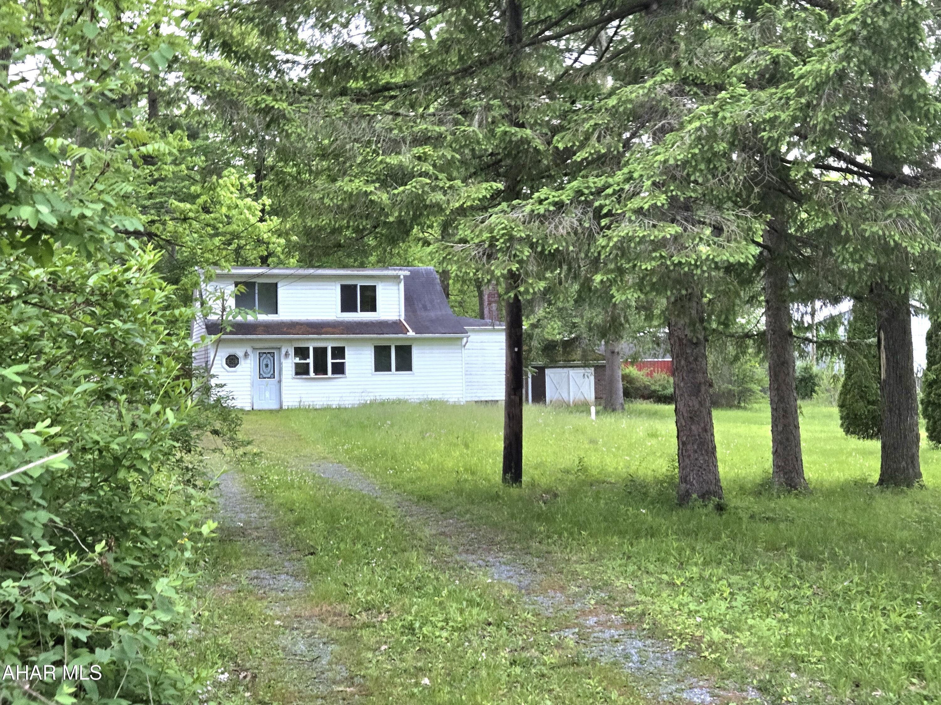 2-bedroom 1-bath vinyl-sided home with 1st floor bedroom, updated Kitchen & Bath with walkin shower, newer windows & doors, +1-car garage on level .72 Acre lot. J-686