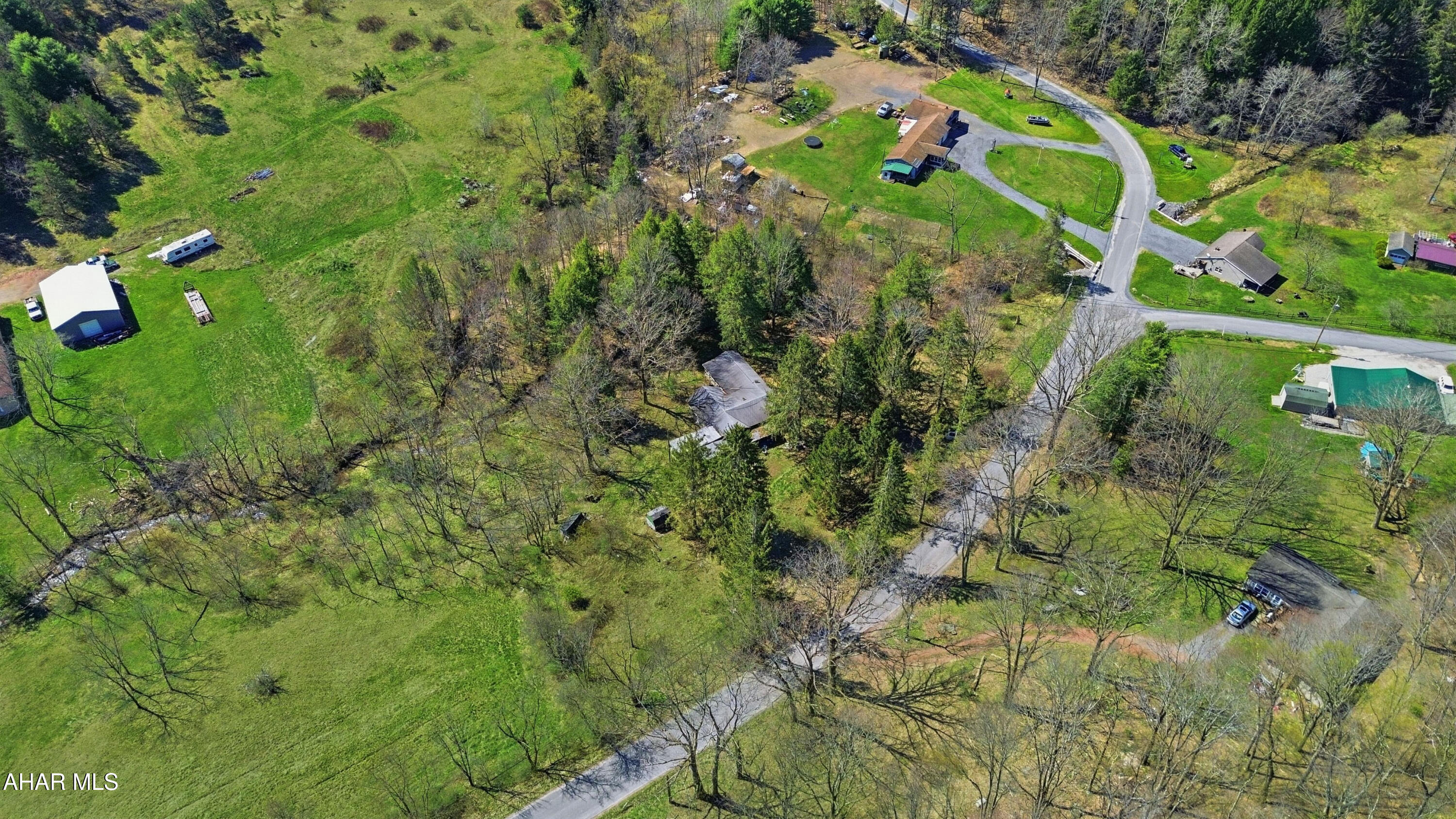 **OFFER DEADLINE FRIDAY THE 10TH @ 7PM**Discover 2.7 acres of beautiful land in Barr Township offering a great blend of privacy and accessibility. This property features excellent road frontage and a small stream running along the rear of the parcel, creating a peaceful setting with plenty of potential. An existing home is currently on the property but has been vacant for quite some time and will likely require demolition. Whether you're looking for a future home site, weekend getaway, or camp location, this property presents a great opportunity. Call today for more information!