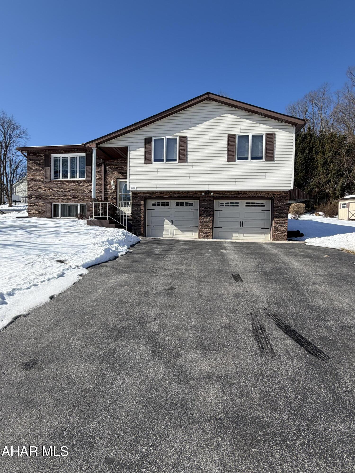Welcome home to this beautifully maintained 3-bedroom, 2.5-bath residence located in one of the most desirable sections of Altoona. This move-in-ready property features a custom oak kitchen with all appliances included, spacious rooms, hardwood floors, and a finished basement complete with a cozy gas fireplace. Numerous upgrades add peace of mind and value, including new carpet, new appliances, a newer furnace, hot water heater, well pump, and roof. Enjoy plenty of closet space, a full basement laundry area with appliances included, and an oversized two-car garage with a workshop. Step outside to a professionally landscaped yard and unwind on the large, half-covered deck—perfect for relaxing in comfort and privacy. Conveniently located just minutes from shopping, dining, I-99, and area attractions, this home offers the perfect blend of comfort, convenience, and quality. (taxes and sq footage must be verified by the buyer)