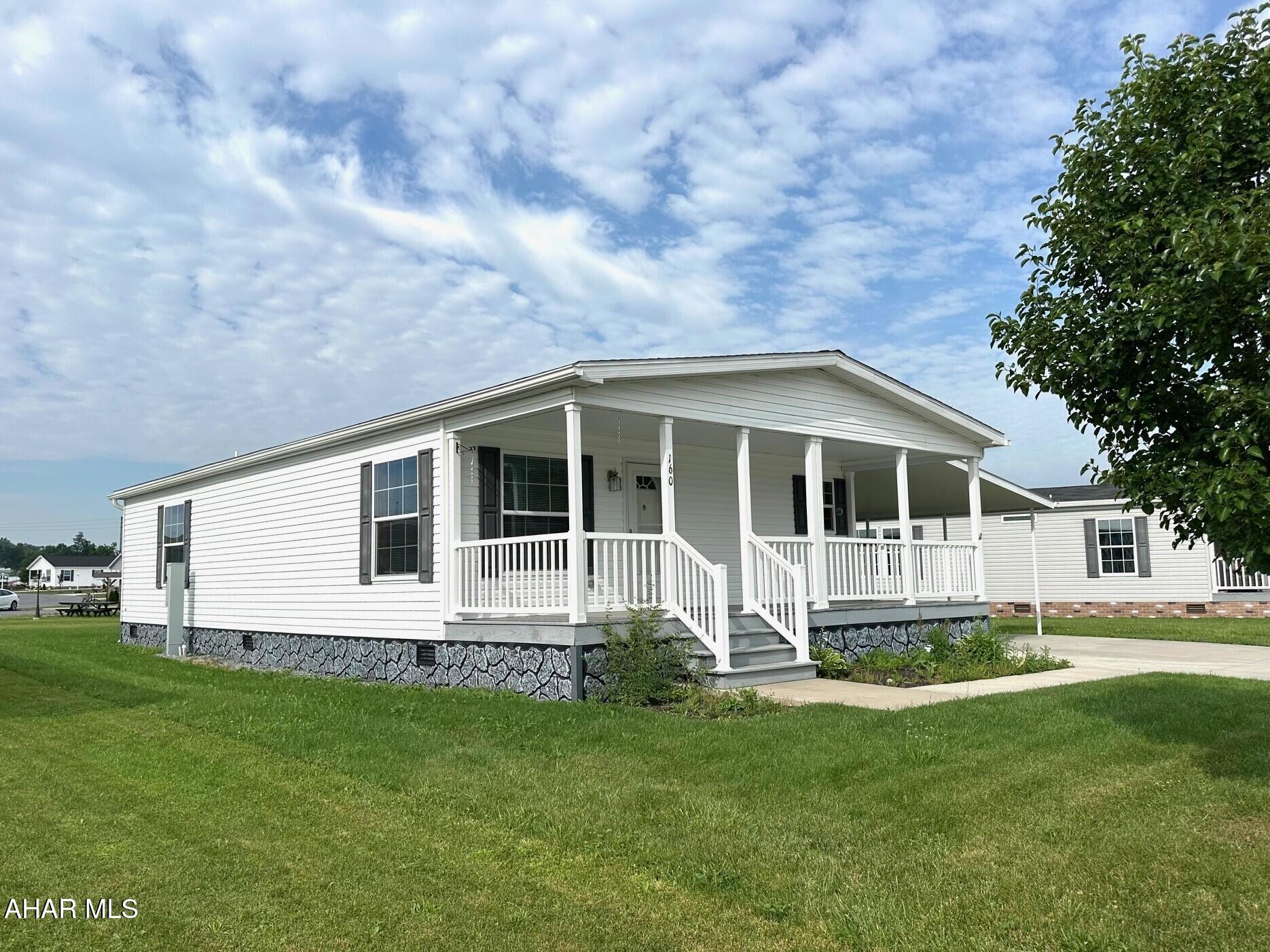 Arrowhead Acres Community is a 55 and over community which offers a lovely well maintained area with little or no up keep to your home. 
The 2020,  2 bedroom 2 bath doublewide home has an open floor plan providing the kitchen, dining and living room all together.  The master suite has a his an her closets and a spacious bathroom with a walk-in shower.  Laundry/mudroom is accessible from the carport.  The shed gives you more storage.
The community offers a community center for the residents. Nice private community!  Room Sizes are Approximate.