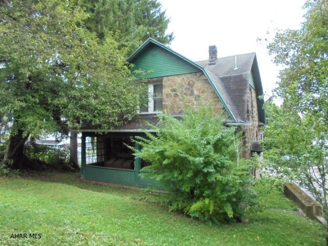 2 story stone 3 BR, 1 1/2 bath home.1 car integral garage. Property is being sold as-is