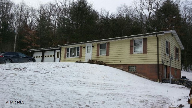 Love the mountain views and 1.15 wooded acres. Bring your creativity to make this home.