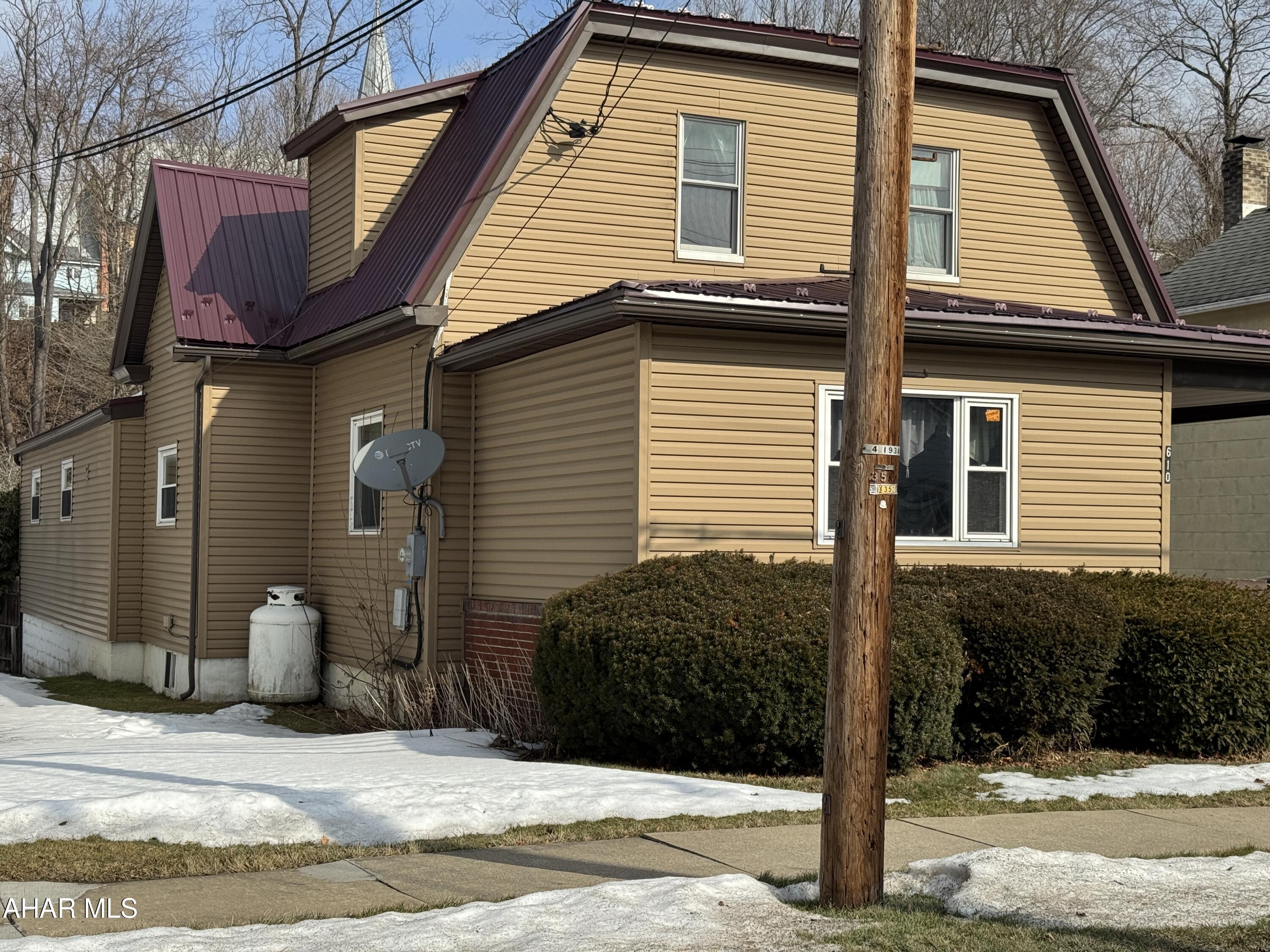 Beautiful vinyl sided two story home featuring a fabulous updated and equipped kitchen, 4 bedrooms (including one on the 1st floor with 3/4 hdc bath) 3 baths,  large living room with propane fireplace, office, utility room and entry room. Full basement with oil hw heat. fenced in rear yard.