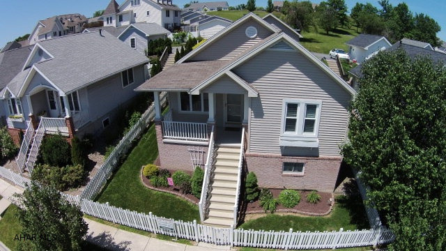Save over new construction.  New upgraded carpeting and extended floor plan.  This house has many more upgraded amenities than the new units being built in the same neighborhood not to mention the brand new 2 car garage just built last year.  This immaculate 2 bedroom, 2 bath cottage is located on exclusive Holliday Hills Drive. It has new hardwood floors and all appliances included with this home.  Move right in!  Built in 2004, this home features cathedral ceilings, skylight, and many upgrades from the base floor plan.  Large full unfinished basement ready for you to finish to your preference.
