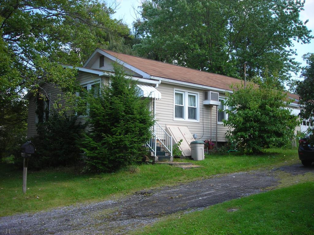Nice quiet area, walk to Curve games. This 4 bedroom one story could use personal ideas and some TLC. Comes with 3 parcels (total) .56 acre. Build on one and keep the others . Zoned Residential/Commercial. Property listed according to recent real estate appraisal. The ground makes it a special buy. Consider all the options.
