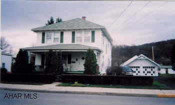 Attractive 2 story 3BR home in a handy in-town location w/detached 2-car garage and professional 32'x26' workshop.