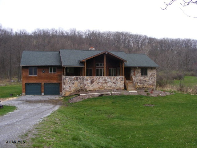 Custoom built 4 bedroom, 3 bath cedar/stone home on 2.14 acres. Offers huge Great Room w/hickory floors and beautiful stone fireplace. Rustic pecan cabinetry in kitchen and baths. Large Master Bedroom with walk-in closet and large Master Bath with jacuzzi tub and his and her sink. Laundry room, formal dining room and eat-in area off kitchen. Large covered porch and large rear deck! 4 zone heating, C/A, full basement that can easily be finished. 2.14 acres, appliances negotiable.