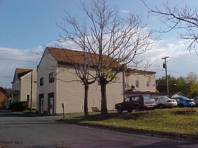 Great Potential!  4 units:  3 apartments rented, 1 unfinished (could be 1st floor business space or another apartment.)  Nice corner lot.  Also fronts 7th Ave.  Newer plumbing, electric, doors, windows & vinyl siding.  J-988