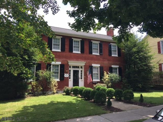 You'll step back to 1834 and love the nostalgic charm and period craftsmanship of the Abraham Karns home. High ceilings, hardwood floors, fireplaces, many original doors and woodwork, original summer house. This brick beauty has a perfect location and offers six bedrooms, three baths as well as a formal dining and living room. Family Room with fireplace and wet bar. Enjoy a first- floor bedroom and laundry room. Beautifully landscaped, very well maintained and improved to preserve the original character. Summer house includes two floors and fireplace. While away the hours on the covered side porches. This property is priced to sell quickly and well-below recent appraised value.