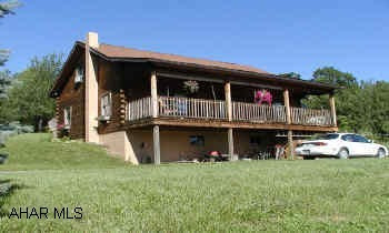 Nice log home on 10+ac. fenced in livestock pen with pasture.Great view 3 Bedroom log home on 10 private acres.  Oil Hot air heat, wood/coal stove as auxilliary heat.