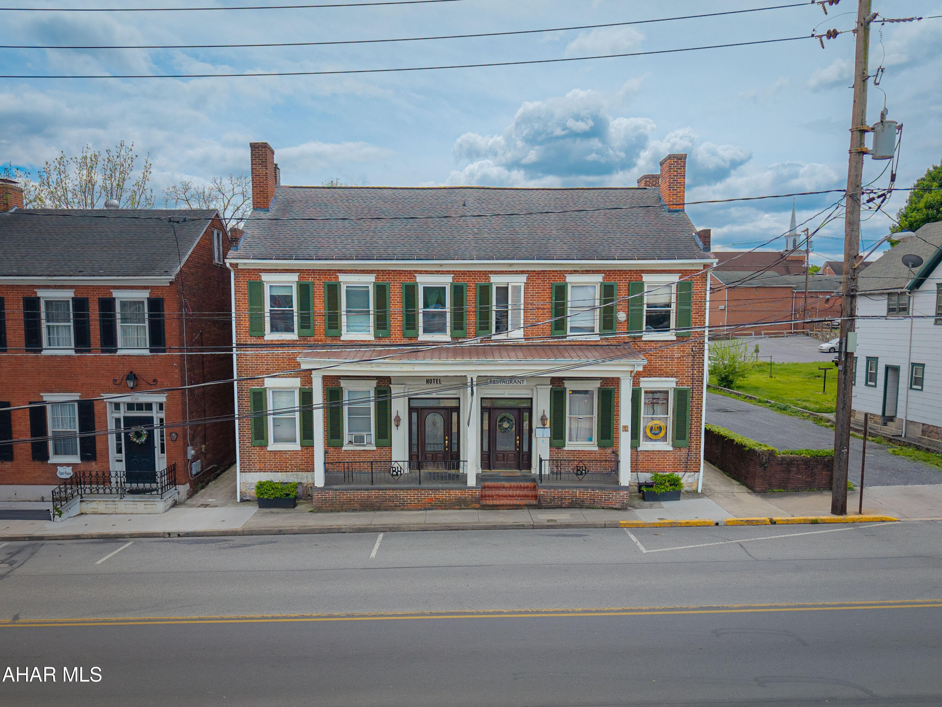 UNLIMITED POTENTIAL !!!  Are you looking to invest in an established business?  Located in quaint, Historical Bedford - this restaurant, tavern, and apartments are  worth a look.
The impressive 1860 brick building had a restaurant on the first floor, with seating for 95+.  Matching mahogany entrance doors welcome diners into the restaurant's 2 dining rooms, which are handicap accessible.  Custom oak woodwork, including window framing, fireplaces, door vestibules - even custom paneled walls.  Take a moment to look at the Before & After photos book of the renovation. Possible first floor retail space with some reconfiguration.
The Tavern is located in the lower level, with a  25 seat bar, table seating for 70 and separate game room with pool table.
Wiring and plumbing have been updated, added insulation, and external ganged electrical panels installed.
A new kitchen was added, five times the size of the original.  All equipment and furnishings for both the restaurant and  bar convey with the property.
The second and third floor apartments provide extra income with one large apartment that could be owners quarters. Property also includes 25 off street parking spaces.
 Bedford's rich history, original architecture, State parks, hiking trails, fishing, Omni Bedford Springs Resort and the Fall Foliage Festival provide lots of things to see and do. Being 2.5 hours in any direction from 3+ major cities make Bedford the perfect destination for day trips, weekends and getaways - providing new and repeat customer flow. All of which makes this property a great opportunity for the savvy investor.