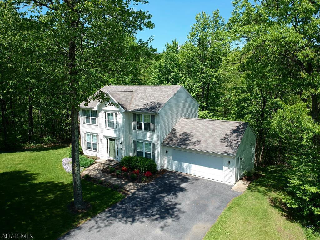 Stunning 4 bedroom 2.5 bath home on an approx 1.81 acre lot in the Mountain Laurel Court neighborhood of Warriors Mark.  Approx 5 minutes from Interstate 99.  This home was built in 2003 by DeHaas Builders of State College and was immaculately kept.  The eat-in kitchen is open to the living area (appliances included).  Access to the rear deck from the kitchen with mountainous views.  There is also a formal dining room off the kitchen.  A den / second living area is situated next to the foyer. 4 large bedrooms on the second level.  The master bedroom has an en-suite bathroom and walk-in closet.  Walkout basement and 2 car attached garage!