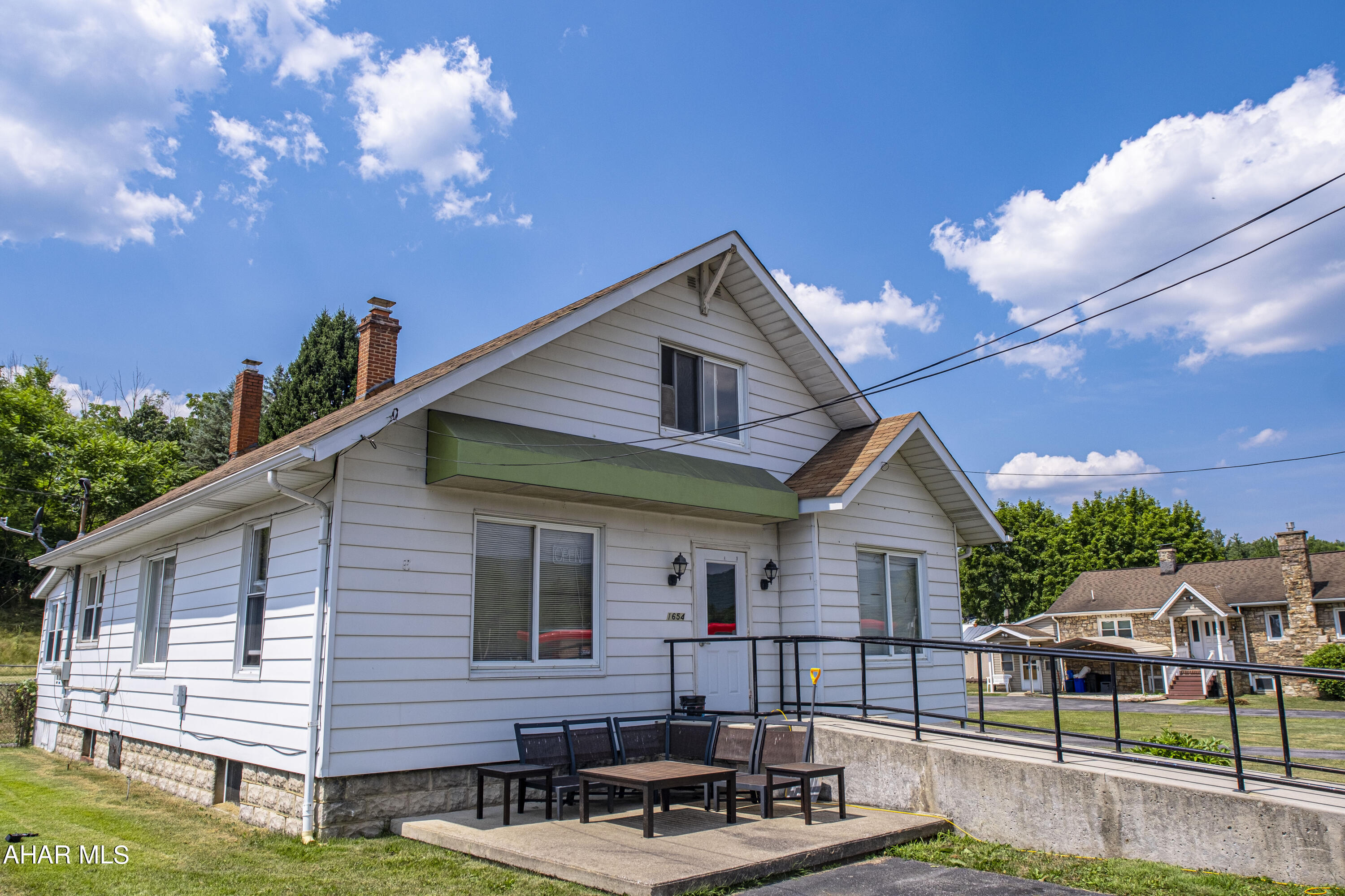 This prime commercial property in the Greenwood section of Altoona provides a high traffic and high visibility location, making it an excellent investment opportunity. The property features a paved parking lot and a handicap accessible ramp, ensuring convenience and accessibility for all. With multiple streams of income, the property includes a commercial space at the front, a 3-bedroom apartment at the rear, and a detached garage, offering diverse rental opportunities. Situated in close proximity to Sheetz and Dollar General, this property has enhanced visibility and convenience, making it an attractive option for both tenants and customers.