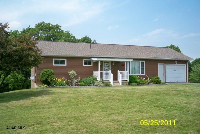 Country setting at it's best! 3BR/2BA ranch on 3.26 acres. Beautiful hickory kitchen w/stainless steel appliances. Finished basement, large deck on upper level and patio on lower level. 28'x40 detached garage, large circular paved driveway/ 12'x16' barn with 1 acre that is fenced. . Beautiful mountain views. Absolutely gorgeous property!