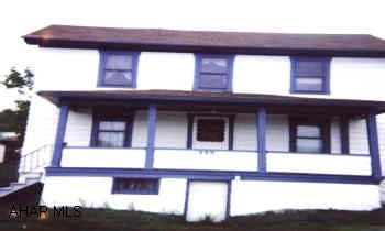 2-STY ALUMINUM SIDED HOME W/3-BR, 1-BA. NICE YARD. 2-CAR DET GAR + PLAYHOUSE/SHED. CALL FOR MORE INFO.