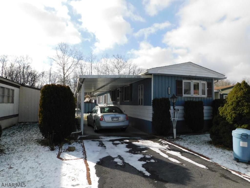 Cozy one story home located in 55+ community.  This home features 2 spacious bedrooms with tons of natural light.  Eat in kitchen with open view to Dining Room and Living Room.  Laundry is conveniently located outside the master bedroom.  Lot rent includes trash and snow removal.  This home is a 1980 14x70 Marlett and features two storage sheds.