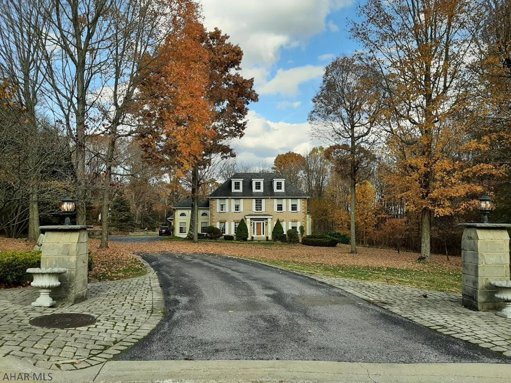 New Price!  TWELVE (12) acres in Westmont Hilltop School District to call your own!  Imagine that!  You get the best of both worlds with this stately, stone, Colonial home.  The house and in-ground pool are located in Westmont Borough.  The tennis court and 10 wooded acres are located behind the house in Lower Yoder Township.  If your family enjoys campfires, hiking, hunting or popping up a tent in the woods, you won't have to go far.  I've walked the property twice, and both times I left in a better mood.  I found the walks to be very calming and peaceful.  The air is so fresh.  The property is not grand or pretentious.  It is comfortable, beautiful, sophisticated, and laid back all at the same time.