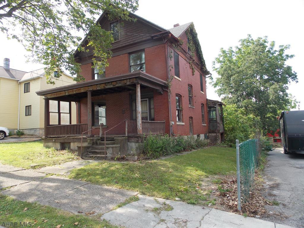 A diamond in the rough! Stunning original woodwork. Have fun restoring this classic beauty to its historical splendor.  Huge lot with back alley access to garage.